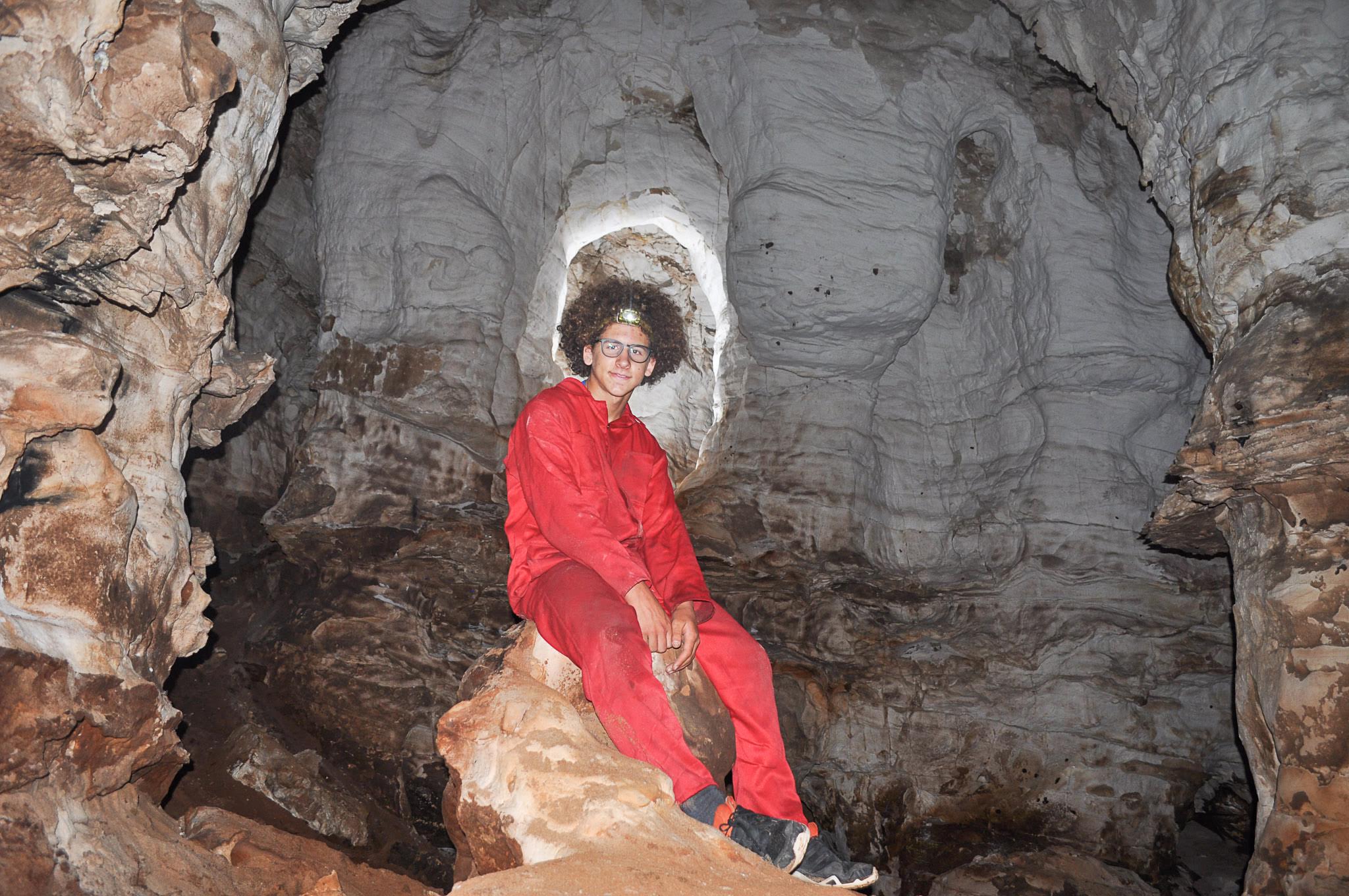 Ronans Well Cave Reece sitting on the remains of the Saucy Dog Main Chamber[Photo][20181202]